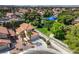 Aerial view of a home and community featuring a tile roof and well-maintained landscaping at 2501 Muirfield Ave, Henderson, NV 89074