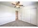 Carpeted bedroom with a ceiling fan and sliding-door closet at 2501 Muirfield Ave, Henderson, NV 89074