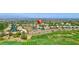 Panoramic aerial view of the property showcasing its location on a golf course with city skyline views at 2997 Via Meridiana, Henderson, NV 89052