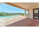 Back patio with a view of the pool and desert landscape, perfect for outdoor entertaining at 2997 Via Meridiana, Henderson, NV 89052
