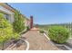 Backyard with beautiful landscaping, and a view of the surrounding scenery at 2997 Via Meridiana, Henderson, NV 89052