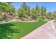Park with grassy area, trees, and a brick pathway for a tranquil outdoor experience at 2997 Via Meridiana, Henderson, NV 89052