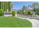 Meridiana entrance showcases lush greenery, stone signage, and stately entrance pillars at 2997 Via Meridiana, Henderson, NV 89052