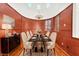 Ornate dining room featuring a black marble table, custom walls, and a chandelier at 2997 Via Meridiana, Henderson, NV 89052