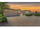 Spacious multi-car garage with a brick paved driveway and manicured landscaping at 2997 Via Meridiana, Henderson, NV 89052