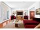 Bright living room showcasing modern furnishings, a large TV, and hardwood floors at 2997 Via Meridiana, Henderson, NV 89052