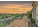 Tranquil stone patio surrounded by lush landscaping, offering stunning views of the city skyline at 2997 Via Meridiana, Henderson, NV 89052