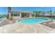 Inviting in-ground pool surrounded by lush landscaping and a spacious patio area, perfect for relaxation at 2997 Via Meridiana, Henderson, NV 89052