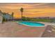 Beautiful in-ground pool with brick decking and unobstructed views of the golf course and sunset at 2997 Via Meridiana, Henderson, NV 89052