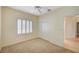 Neutral bedroom with carpet flooring, a window with shutter blinds, and a closet at 3025 Seaford Peak Dr, Henderson, NV 89052