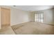 Spacious living room with sliding door leading to outdoor space and adjacent dining area at 3025 Seaford Peak Dr, Henderson, NV 89052