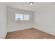 Well-lit bedroom features a large window offering ample natural light and neutral carpet at 304 Orland St # 47, Las Vegas, NV 89107