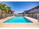 A refreshing community pool surrounded by lush palm trees, perfect for relaxation and recreation at 304 Orland St # 47, Las Vegas, NV 89107