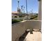 Balcony view showcasing lush landscaping, palm trees, and a well-maintained community at 3150 Soft Breezes Dr # 1167, Las Vegas, NV 89128