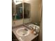Bathroom featuring a well-lit sink with dual mirrored cabinets above at 3150 Soft Breezes Dr # 1167, Las Vegas, NV 89128