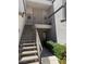 Exterior shot featuring stair access to apartments, showcasing secure entrances and well-kept landscaping at 3150 Soft Breezes Dr # 1167, Las Vegas, NV 89128