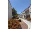 Beautiful exterior shot showcasing landscaped walkway, well maintained building, and inviting community atmosphere at 3150 Soft Breezes Dr # 1167, Las Vegas, NV 89128