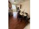 Cozy eat-in kitchen with wood floors and modern lighting fixtures at 3150 Soft Breezes Dr # 1167, Las Vegas, NV 89128