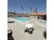 Resort style pool area with hot tub, lounge seating, and palm trees, creating a relaxing community space at 3150 Soft Breezes Dr # 1167, Las Vegas, NV 89128