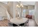 Elegant dining room with hardwood floors, staircase and soaring ceilings at 3420 Lockport St, Las Vegas, NV 89129