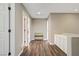 Upstairs hallway with wood flooring, built-in cabinets, and easy access to bedrooms and bathrooms at 3420 Lockport St, Las Vegas, NV 89129