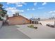 Large backyard features a fire pit, covered area, patio, and a chain-link fence at 3715 Tabor Ave, North Las Vegas, NV 89030