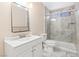 Bright bathroom features a modern vanity, and glass enclosed shower with decorative tile surround at 3715 Tabor Ave, North Las Vegas, NV 89030