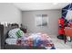 Bright bedroom boasts a window and creative decor at 3715 Tabor Ave, North Las Vegas, NV 89030