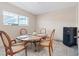 Dining room features tile floors, window, and a modern dining table with seating for four at 3715 Tabor Ave, North Las Vegas, NV 89030