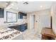 The kitchen features granite countertops, white appliances, black cabinets, and tile flooring at 3715 Tabor Ave, North Las Vegas, NV 89030