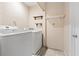 Functional laundry room equipped with a washer and dryer, and convenient shelving at 3715 Tabor Ave, North Las Vegas, NV 89030
