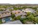 Lush backyard featuring a pristine pool and luxurious outdoor seating areas at 38 Moonfire Dr, Las Vegas, NV 89135