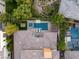 An aerial view features a backyard oasis with a pool, spa, fire pit, and lush landscaping at 38 Moonfire Dr, Las Vegas, NV 89135
