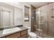 Modern bathroom featuring a tiled shower with glass door, contemporary vanity, and neutral color palette at 38 Moonfire Dr, Las Vegas, NV 89135
