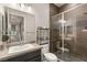 Well-lit bathroom features a glass shower and modern fixtures at 38 Moonfire Dr, Las Vegas, NV 89135