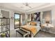 Cozy bedroom with a sliding glass door to a private balcony, complete with modern furnishings at 38 Moonfire Dr, Las Vegas, NV 89135