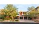 A charming two-story home boasts a modern exterior with a gated entrance and spacious driveway at 38 Moonfire Dr, Las Vegas, NV 89135