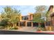 A charming two-story home boasts a modern exterior with a gated entrance and spacious driveway at 38 Moonfire Dr, Las Vegas, NV 89135