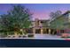 Stunning home exterior features a modern design, lush landscaping, and an inviting entrance at 38 Moonfire Dr, Las Vegas, NV 89135