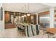 Open concept kitchen with a large island, modern appliances, and decorative backsplash at 38 Moonfire Dr, Las Vegas, NV 89135