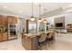 Open-concept kitchen featuring a large island with seating and modern stainless steel appliances at 38 Moonfire Dr, Las Vegas, NV 89135