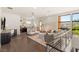 Stylish living room featuring tile floors, a wet bar, and large windows at 38 Moonfire Dr, Las Vegas, NV 89135