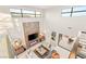 Open-concept living room with high ceilings and herringbone accent wall at 38 Moonfire Dr, Las Vegas, NV 89135