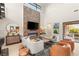Elegant living room with a sleek fireplace, modern decor, and cozy seating arrangement at 38 Moonfire Dr, Las Vegas, NV 89135