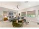 Spacious main bedroom with sitting area, ceiling fan, and natural light at 38 Moonfire Dr, Las Vegas, NV 89135