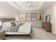 Serene main bedroom featuring a comfortable bed, modern decor, and plenty of natural light at 38 Moonfire Dr, Las Vegas, NV 89135