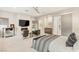 Relaxing main bedroom featuring a fireplace, tv, and sliding barn door at 38 Moonfire Dr, Las Vegas, NV 89135