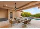 Inviting outdoor living space with a fire pit, comfortable seating, and a clear view of the sparkling pool at 38 Moonfire Dr, Las Vegas, NV 89135