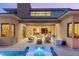 A luxurious patio with plush seating, an outdoor spa, and seamless indoor-outdoor living at 38 Moonfire Dr, Las Vegas, NV 89135