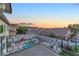 Balcony with patterned railing overlooking a backyard with a pool and lush greenery at 387 Hoskins Ct, Henderson, NV 89012